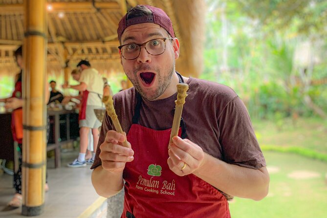 Balinese Farm Cooking Class by Pemulan Bali - Picking ingredients in Pemulan Bali’s garden