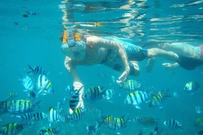 Blue Lagoon Snorkeling Kanto Lampo and Tegenungan Waterfall Tour - Blue Lagoon and Tanjung Jepun by traditional boat