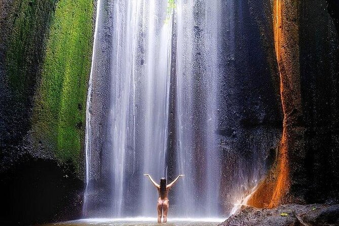Discover the best waterfalls in Ubud and rice terraces tour - Tukad Cepung Waterfall, sunlight in a narrow valley