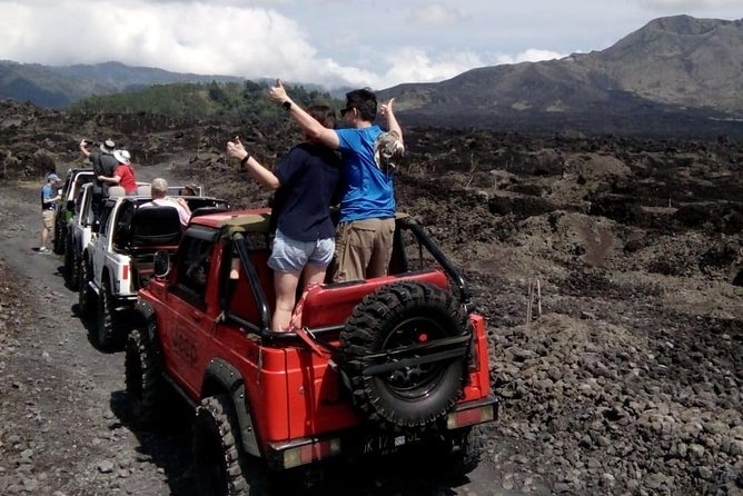 Mount Batur Jeep Sunrise & Overnight Glamping Experience - Black lava and sand fields after sunrise