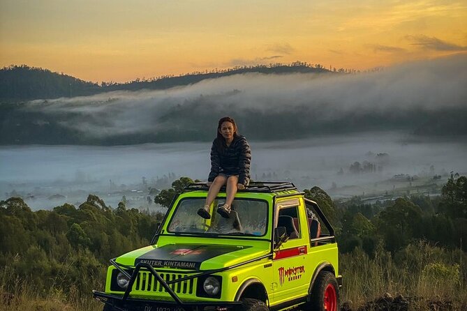 Mount Batur Jeep Sunrise Tour - All Inclusive - Watching sunrise from Mount Batur’s slopes