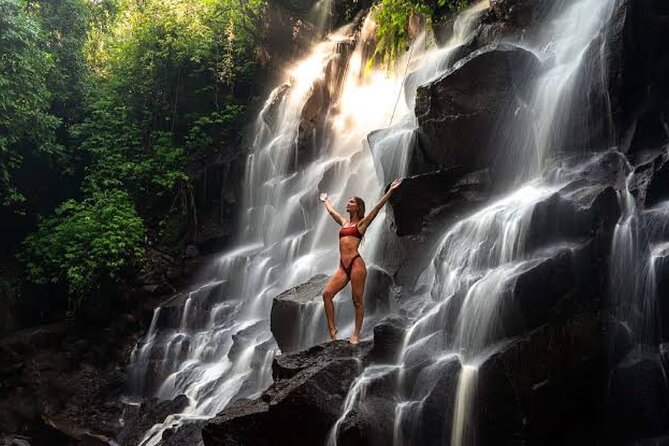 Private Day Tour To Waterfalls And Ubud Sightseeing - Kanto Lampo Waterfall’s broad rock shelves